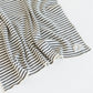 Striped fabric with a brand label on a white background
