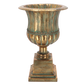 Decorative urn with a textured surface on a white background