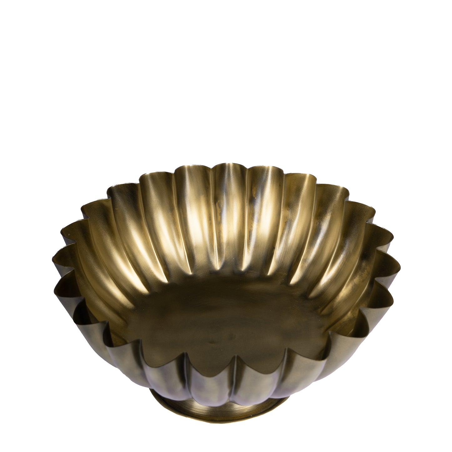 Decorative brass bowl with fluted design on a white background