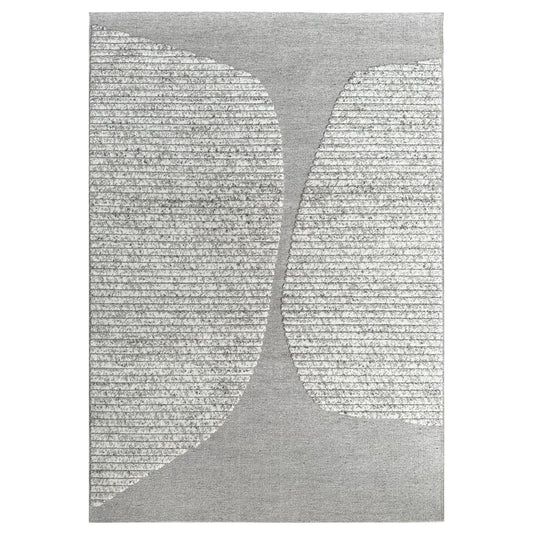 Gray area rug with abstract leaf design on a white background