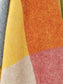 Close-up of multicolored fabric with herringbone pattern