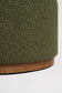 Close-up of a green textured ottoman with a wooden base on a white background