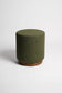 Green textured stool on a white background