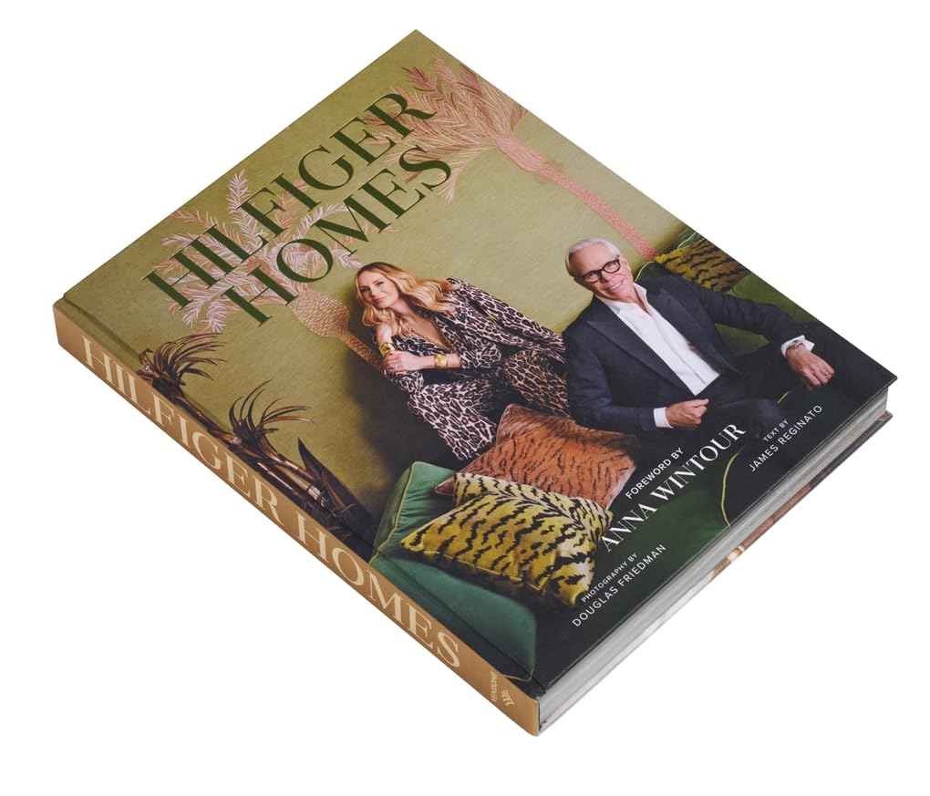 Book titled 'Foliesger Homes' with a cover featuring two people and decorative elements.