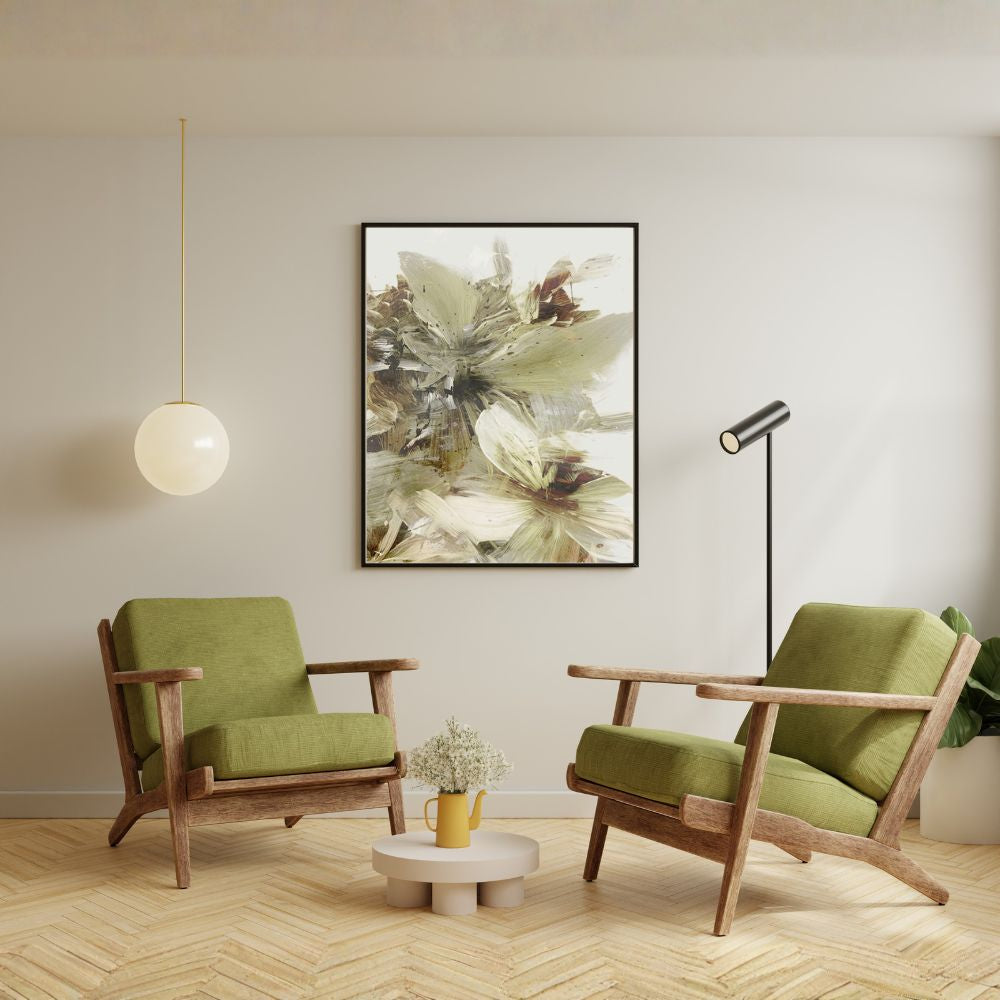 Modern living room with green armchairs, a small table, and a floral painting on the wall.