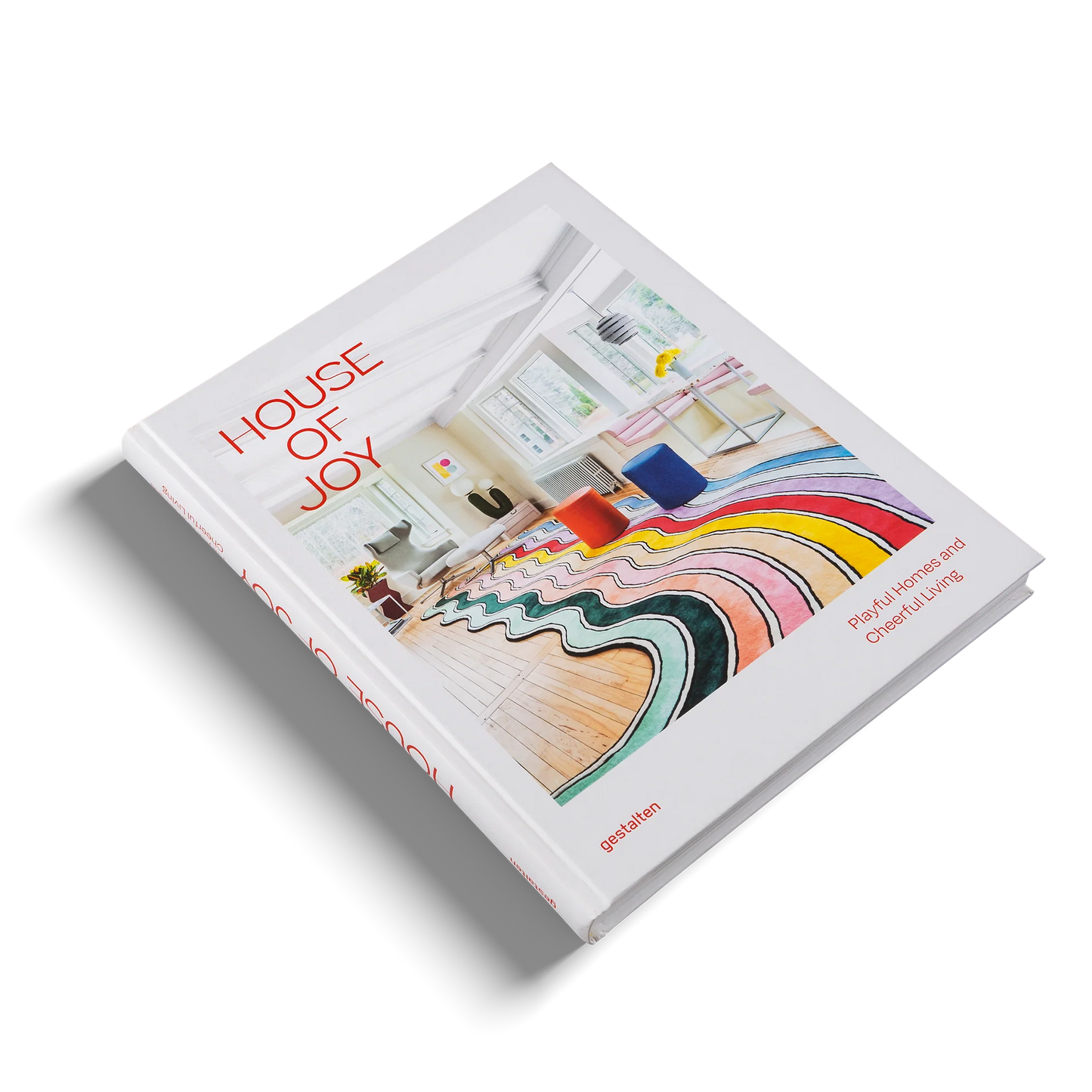 Book titled 'House of Joy' with colorful interior design illustration on a white background
