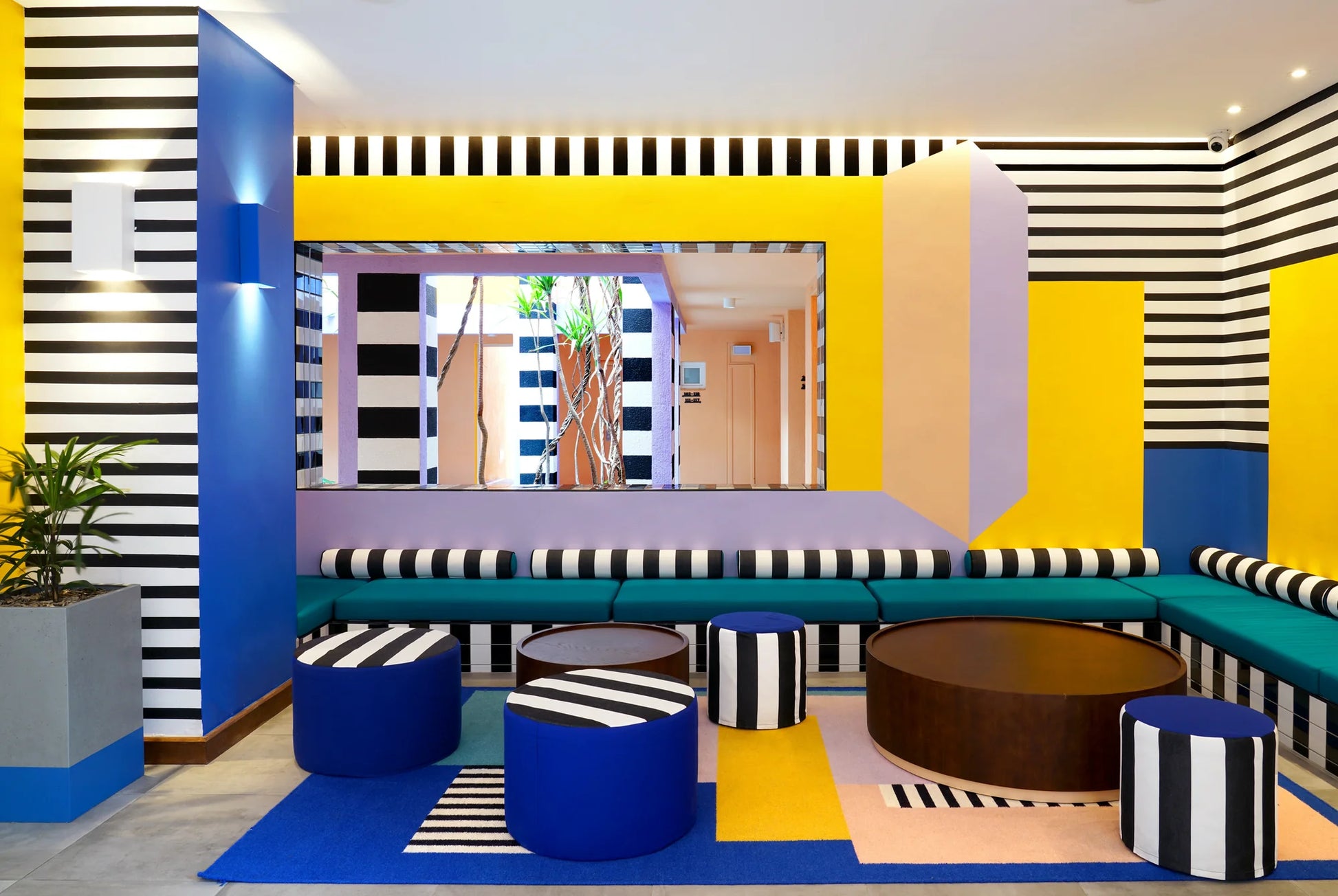 Modern interior design with geometric patterns and colorful furniture.