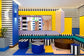 Modern interior design with geometric patterns and colorful furniture.