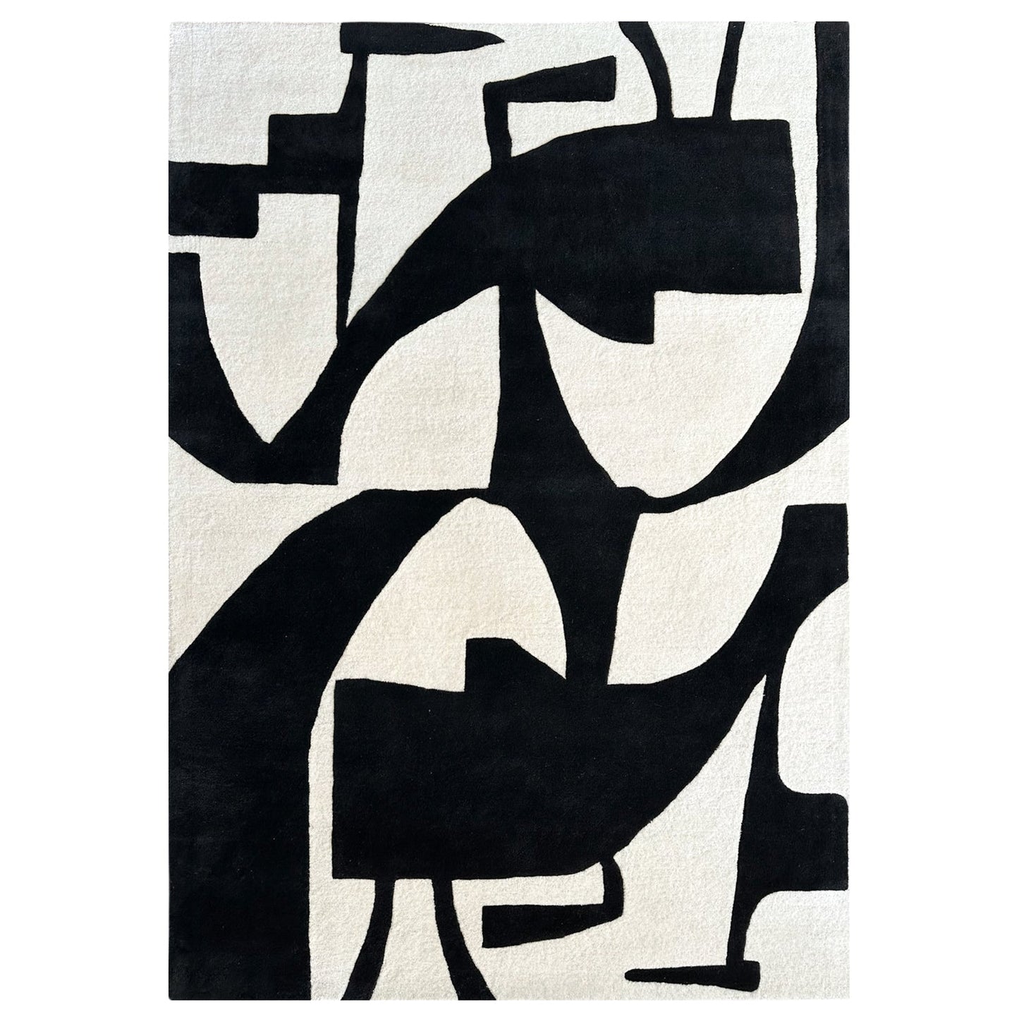 Abstract black and white rug with geometric patterns on a plain background