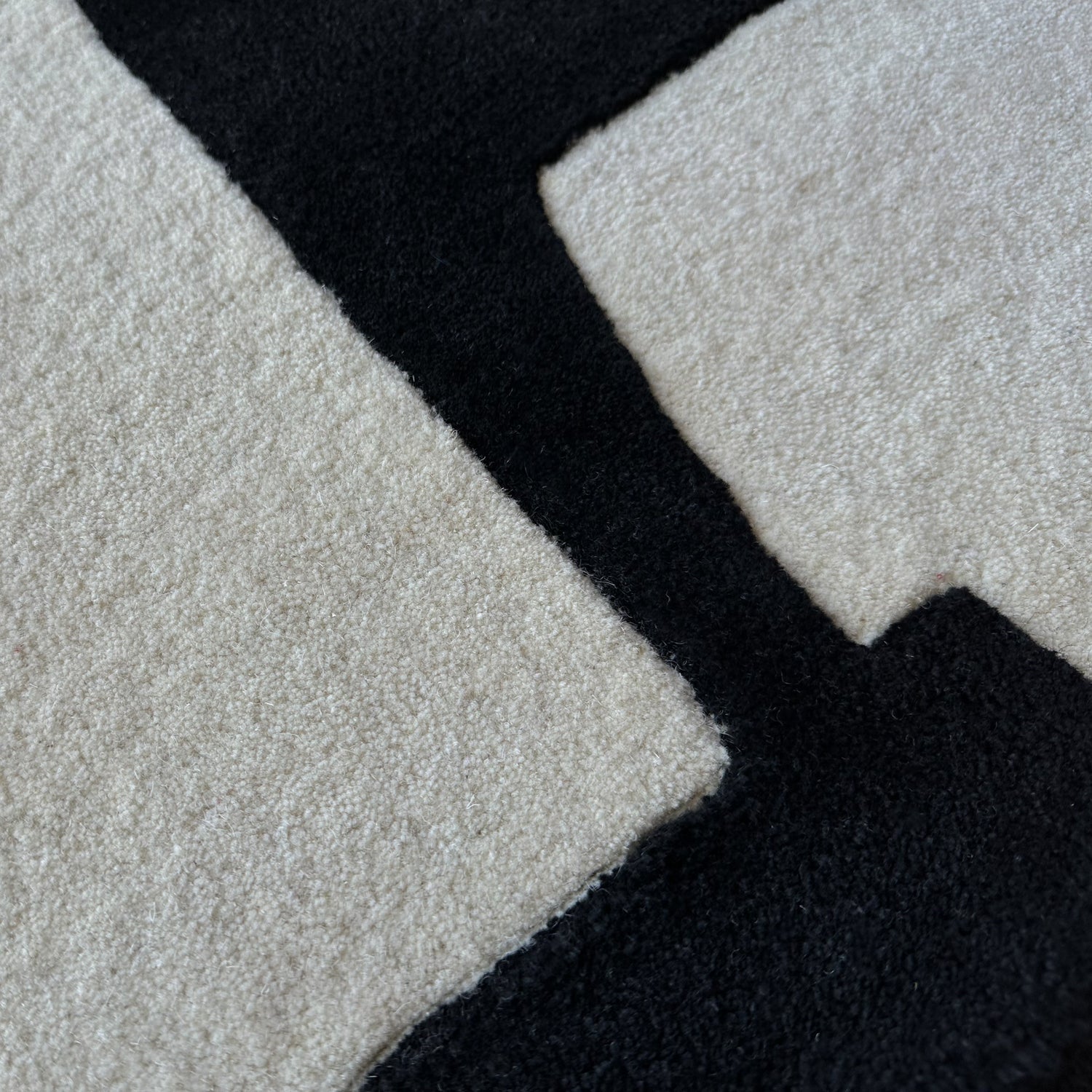 Close-up of a textured surface with black, gray, and white colors.