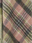 Close-up of a plaid fabric with green and pink