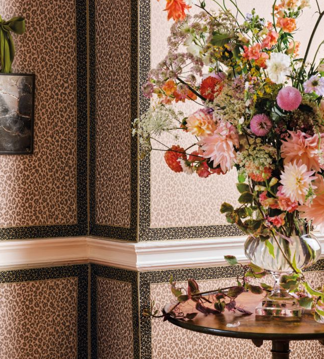 Decorative interior with floral arrangement and patterned walls