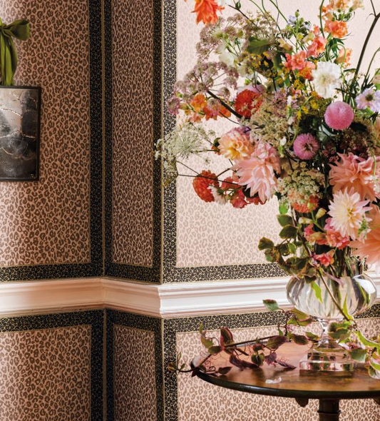 Decorative interior with floral arrangement and patterned walls