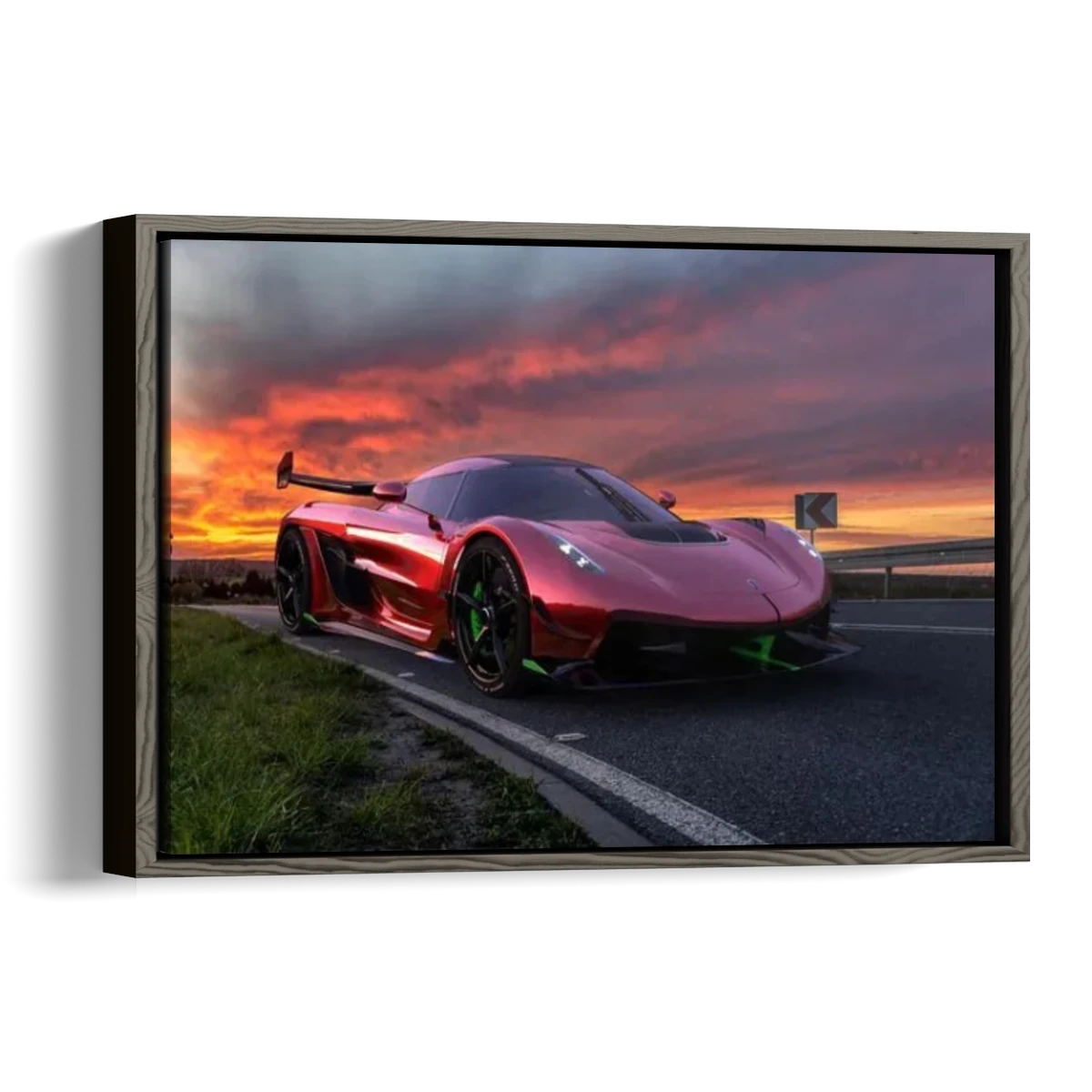 A framed wall art print showing a red sports car on a road at sunset, presented as a 3D gallery wrap canvas against a white background.