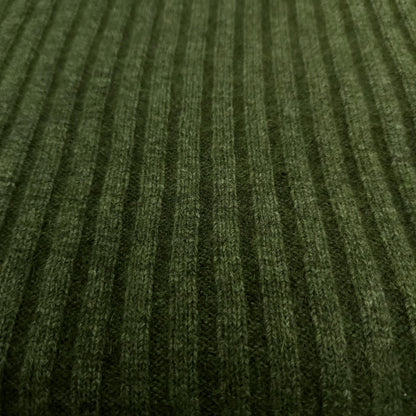 A ribbed throw in moss green,