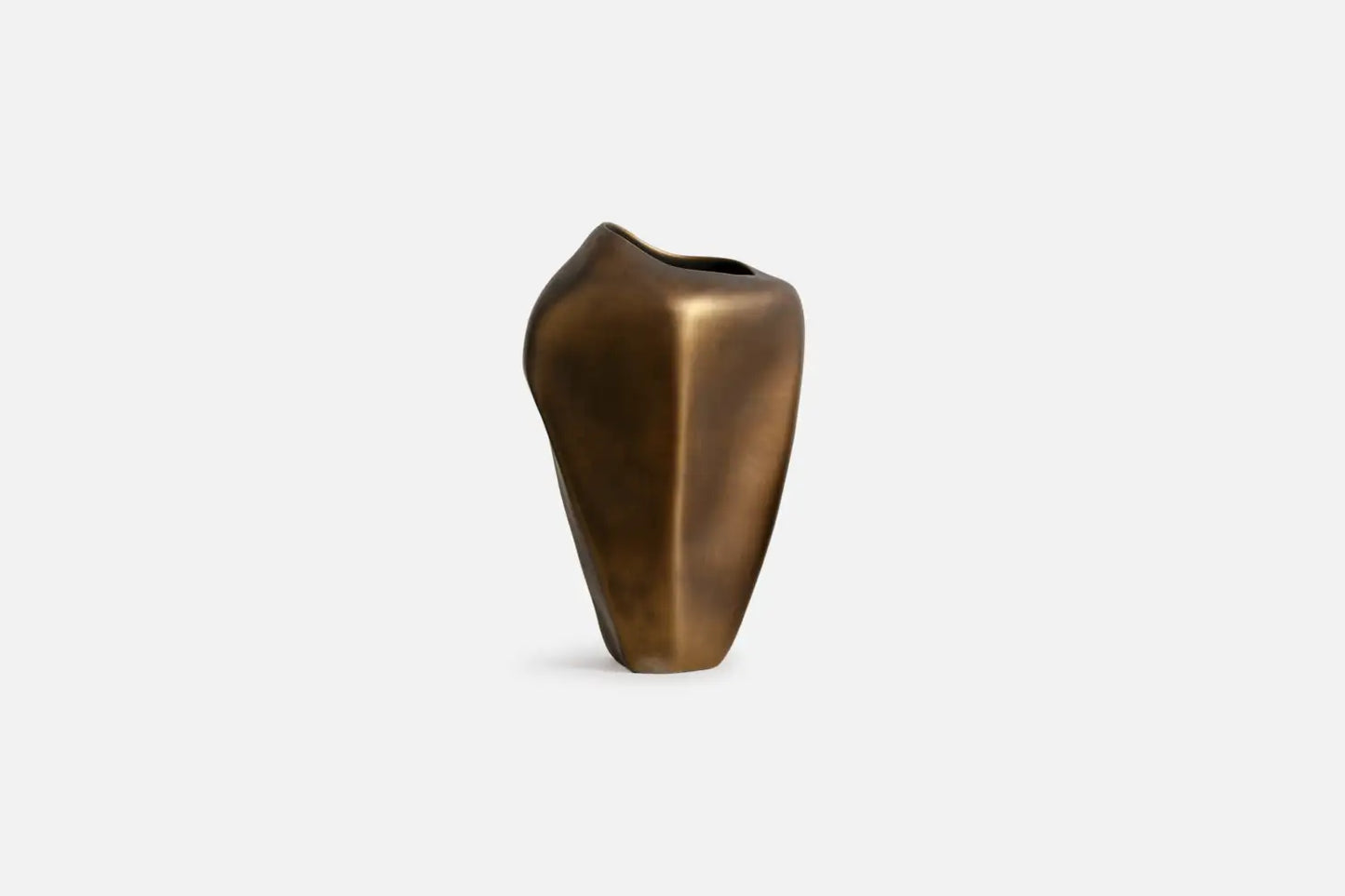 A small sculptural vase with a matte bronze finish, featuring an organic, rounded shape and a wide, open top, set against a plain light gray background.