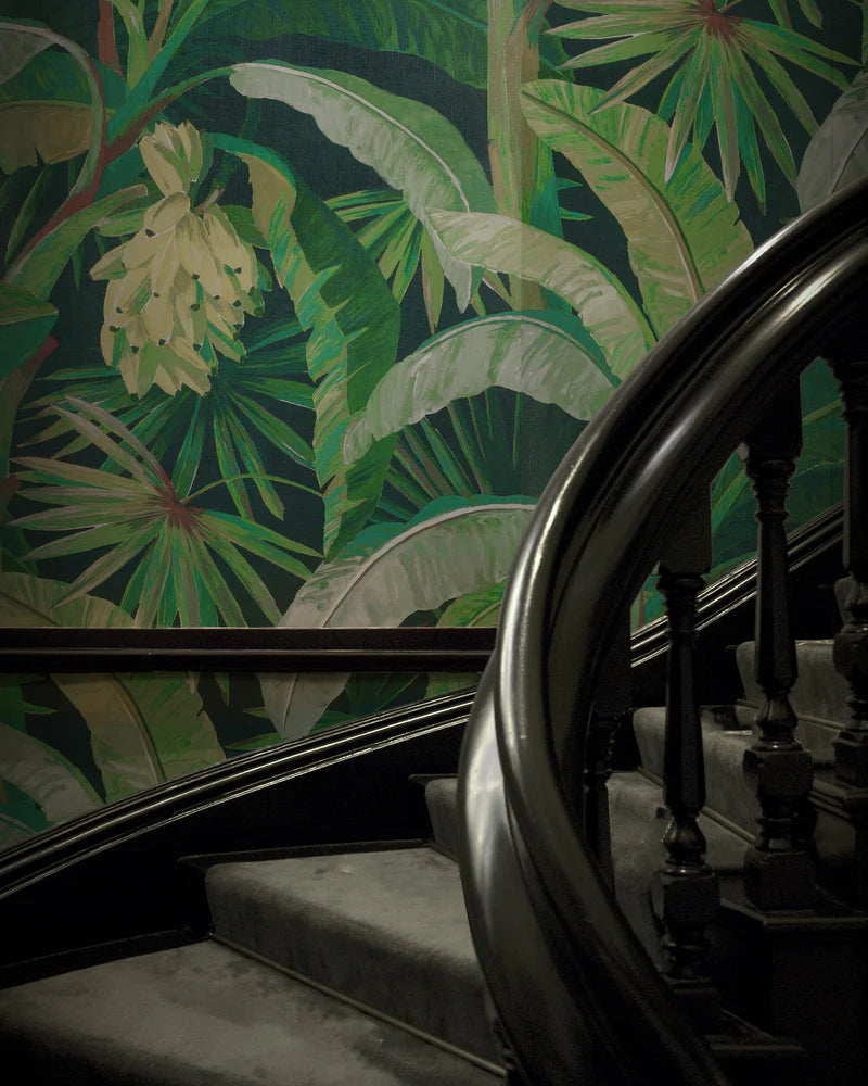 Staircase with decorative green leaf wallpaper