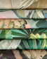 Stack of fabric swatches with tropical leaf patterns