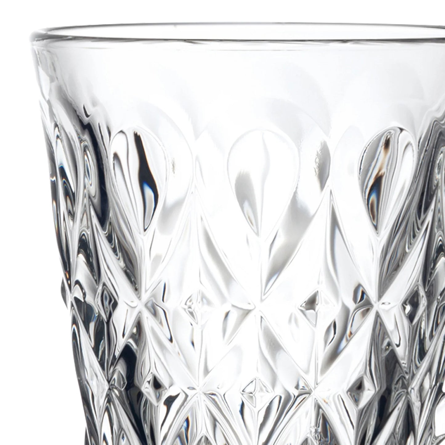A close-up of a clear cut-glass tumbler with an intricate geometric pattern, shown against a plain white background.