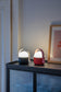 Round topped portable lamps on a drinks cabinet