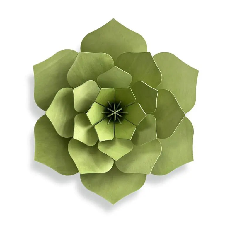 Green wooden flower wall decoration on a white background