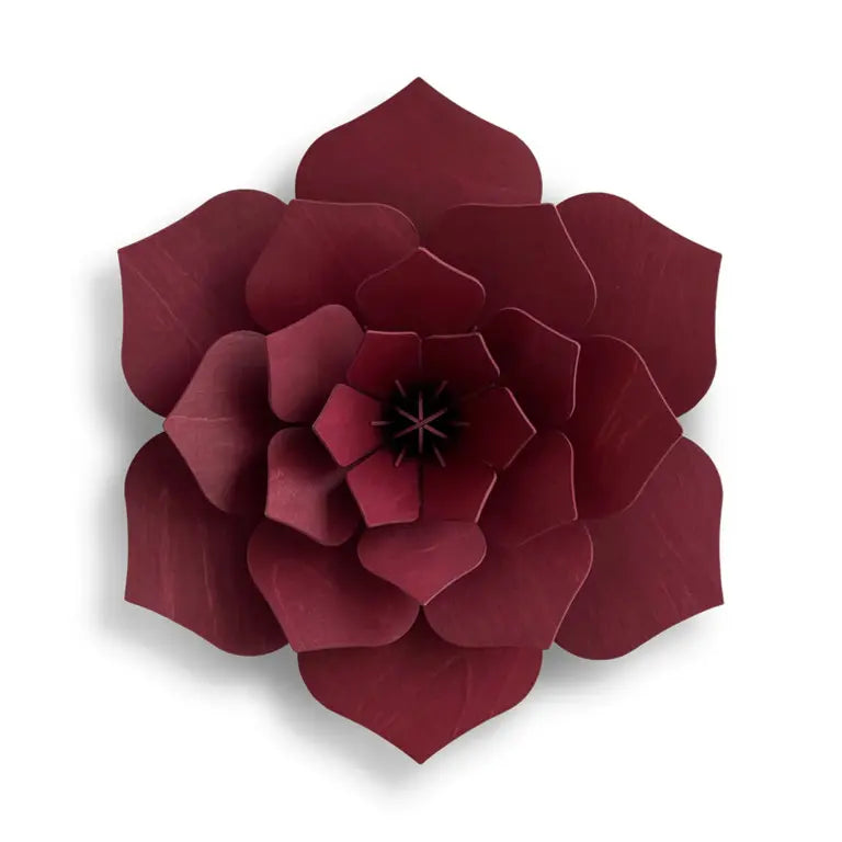 Maroon wooden flower wall decor on a white background