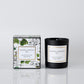 Manuel Canovas candle and packaging on a light gray background