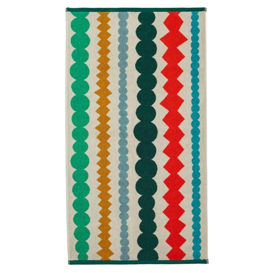 Colorful geometric patterned rug on a white background