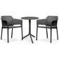 Two black chairs and a round table on a white background