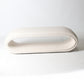 open oval bench in ivory