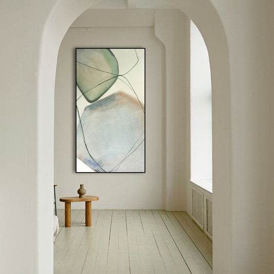 Abstract art piece on a wall in a minimalistic room with wooden stool and vase.