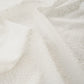 Close-up of textured white fabric