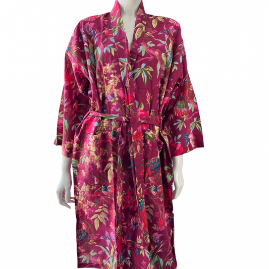 Red floral patterned robe on a mannequin against a white background