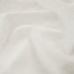 White drapery fabric embroidered with dots