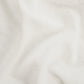 White drapery fabric embroidered with dots