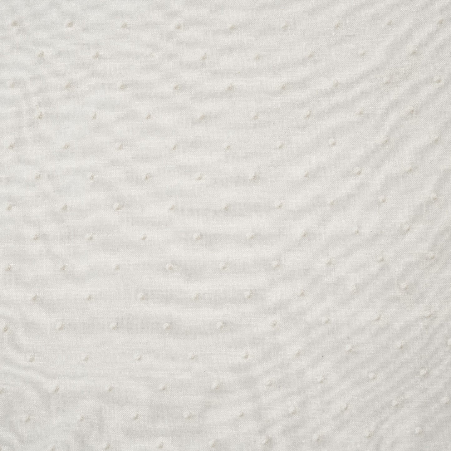 White drapery fabric embroidered with dots