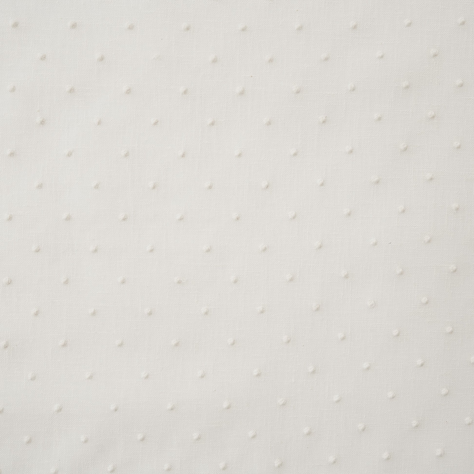 White drapery fabric embroidered with dots