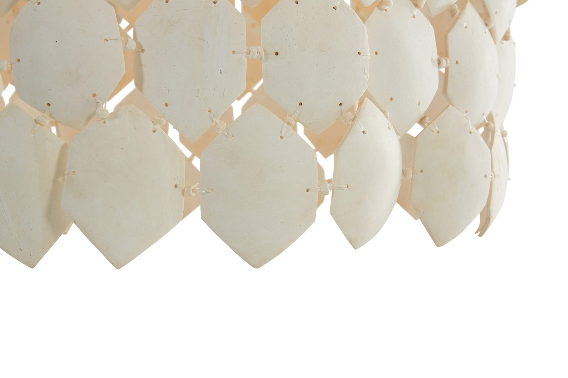 Close-up of a decorative wall panel with geometric honeycomb pattern on a white background