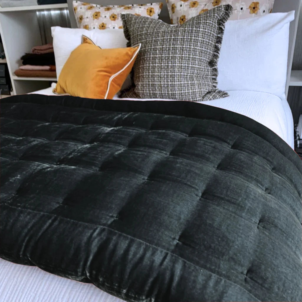 Pin Velvet comforter on bed in black
