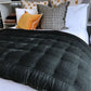 Pin Velvet comforter on bed in black
