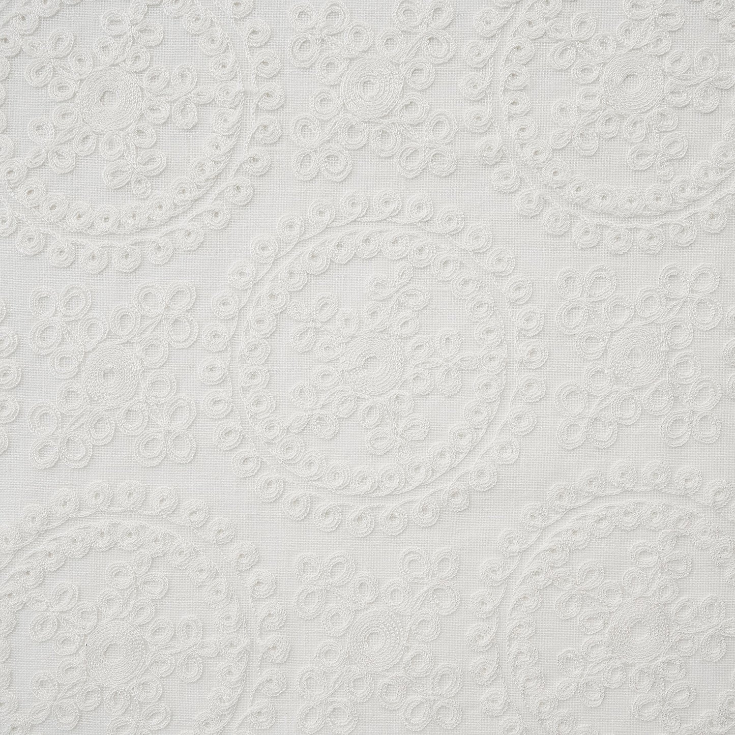 ivory embroidered fabric with circular patterns