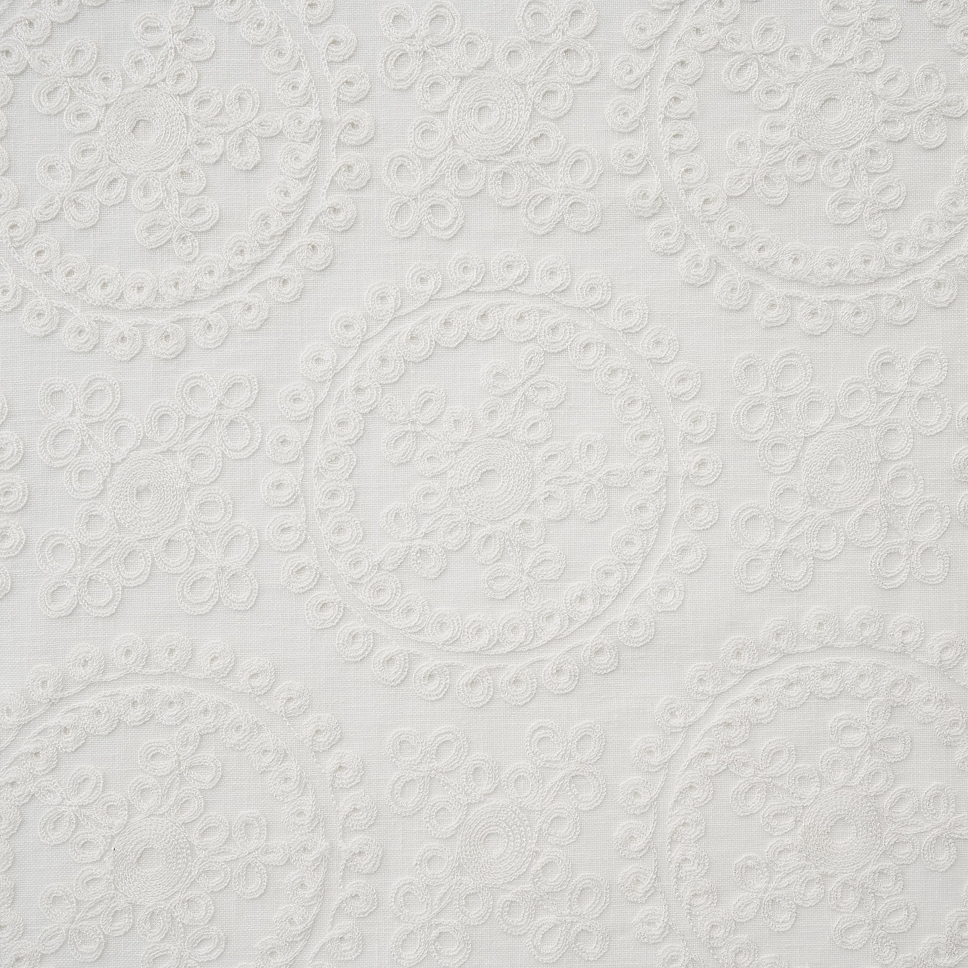 ivory embroidered fabric with circular patterns