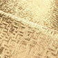 Close-up of a woven gold wallpaper 