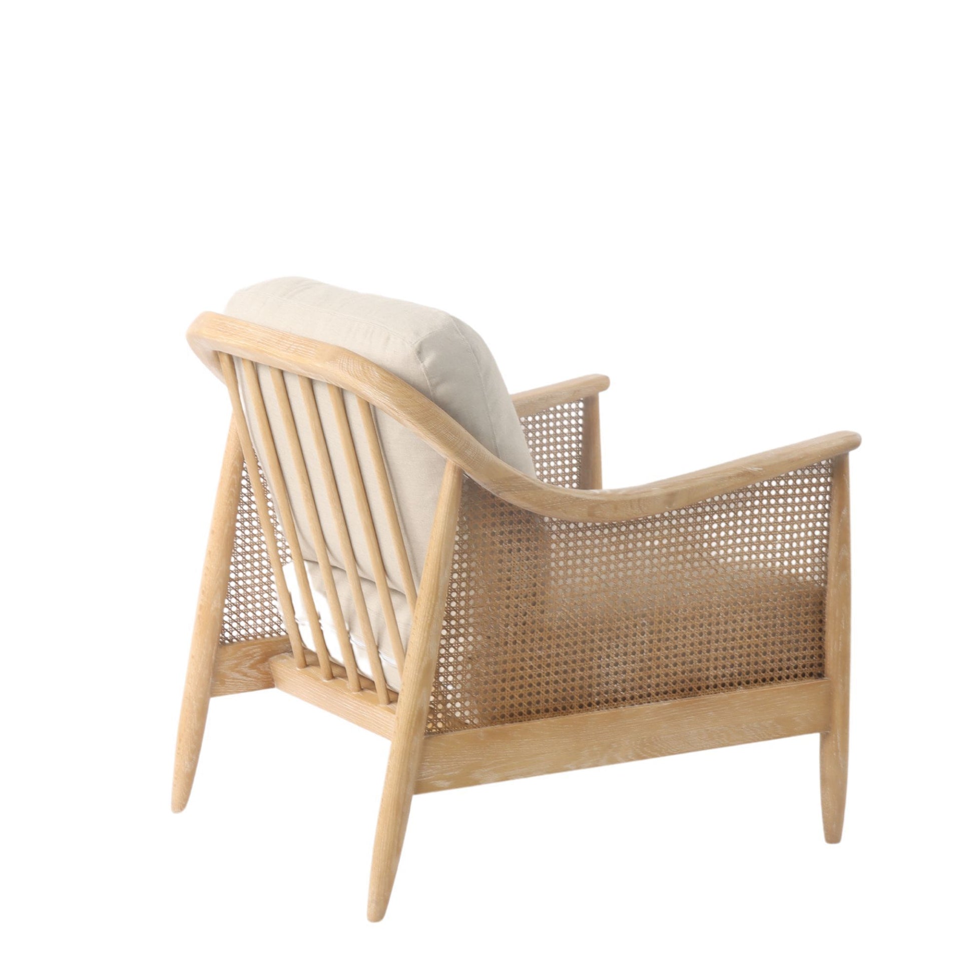 Wooden armchair with woven backrest and beige cushion on a white background