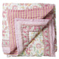 Floral and striped quilt on a white background