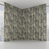 Floral patterned curtains in a room with large windows.