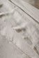 Close-up of beige Sova bed linen with a subtle pattern