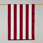 Red and white large striped towel with stars along the edge