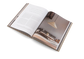Open book with a photograph of a pyramid on a white background