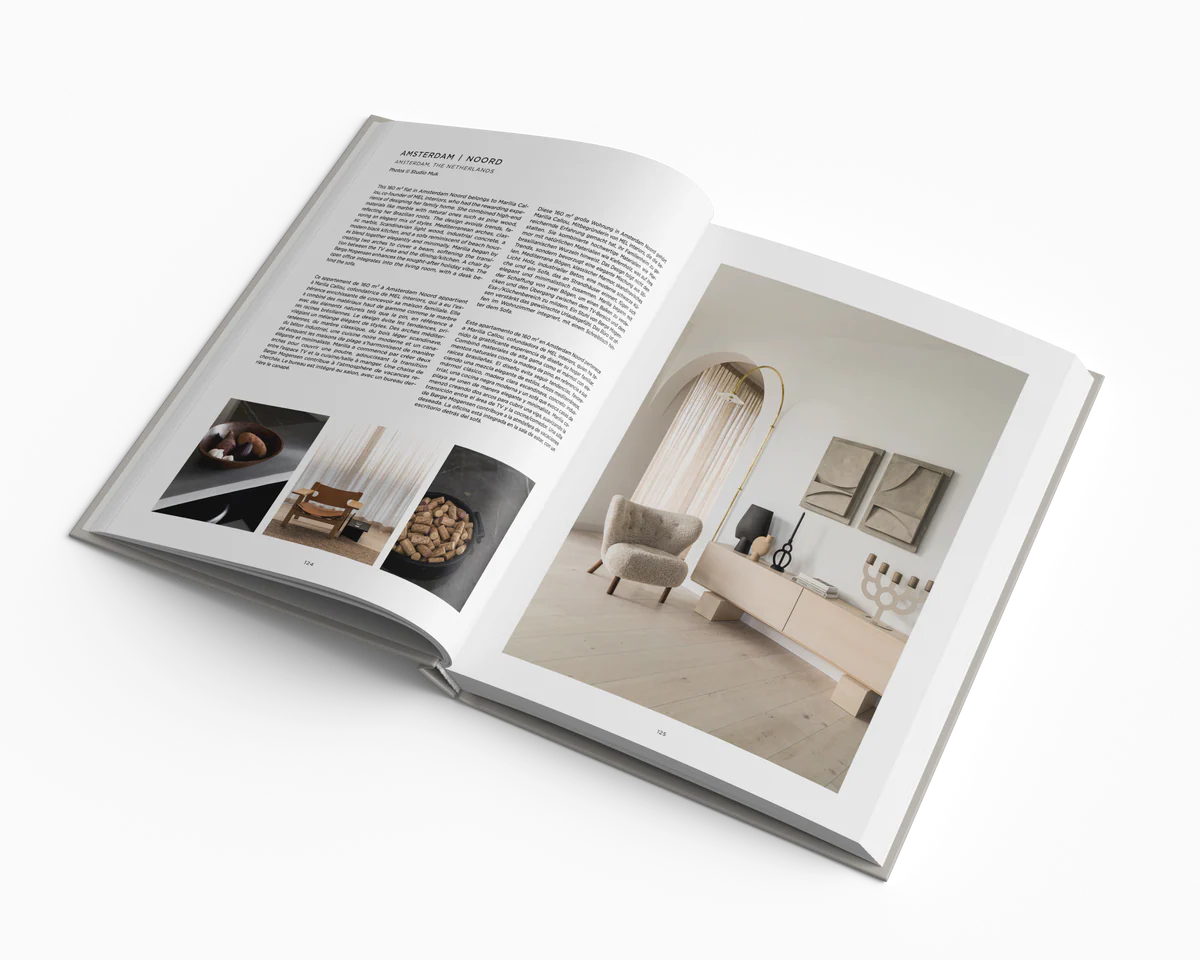 Open book showing interior design images and text on a white background